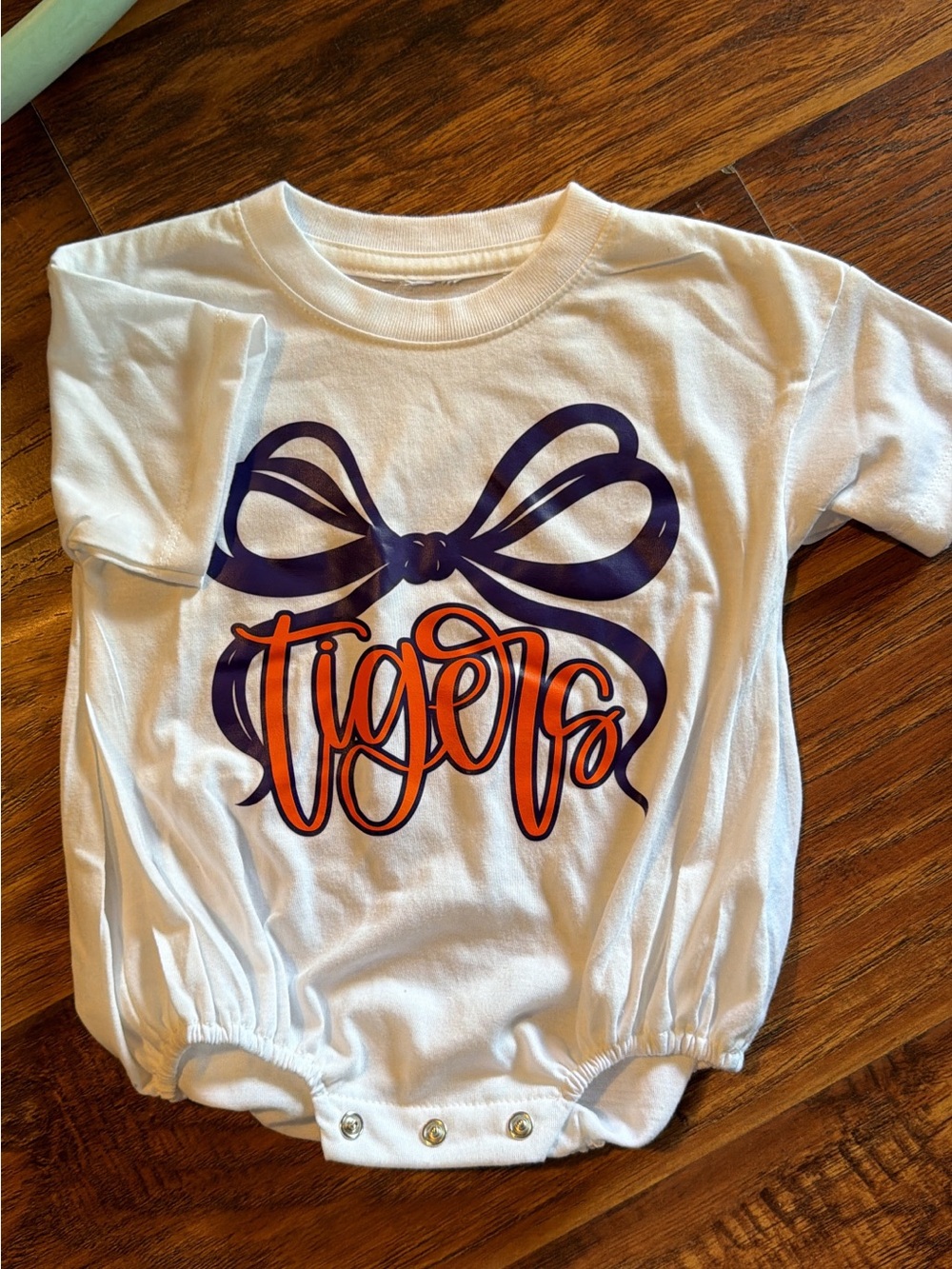 White Baby Bodysuit with Navy Bow and Orange "Tigers" Script